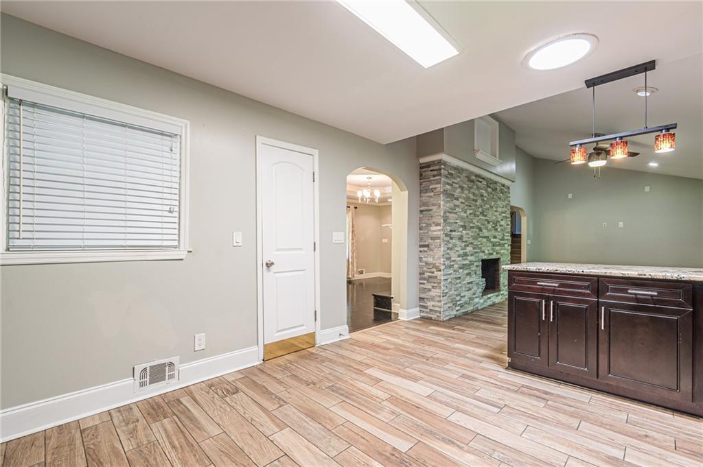 1574 Old Spring House Lane Atlanta, GA 30338 - Photo 20 of 55 a bedroom with a bed and a dresser