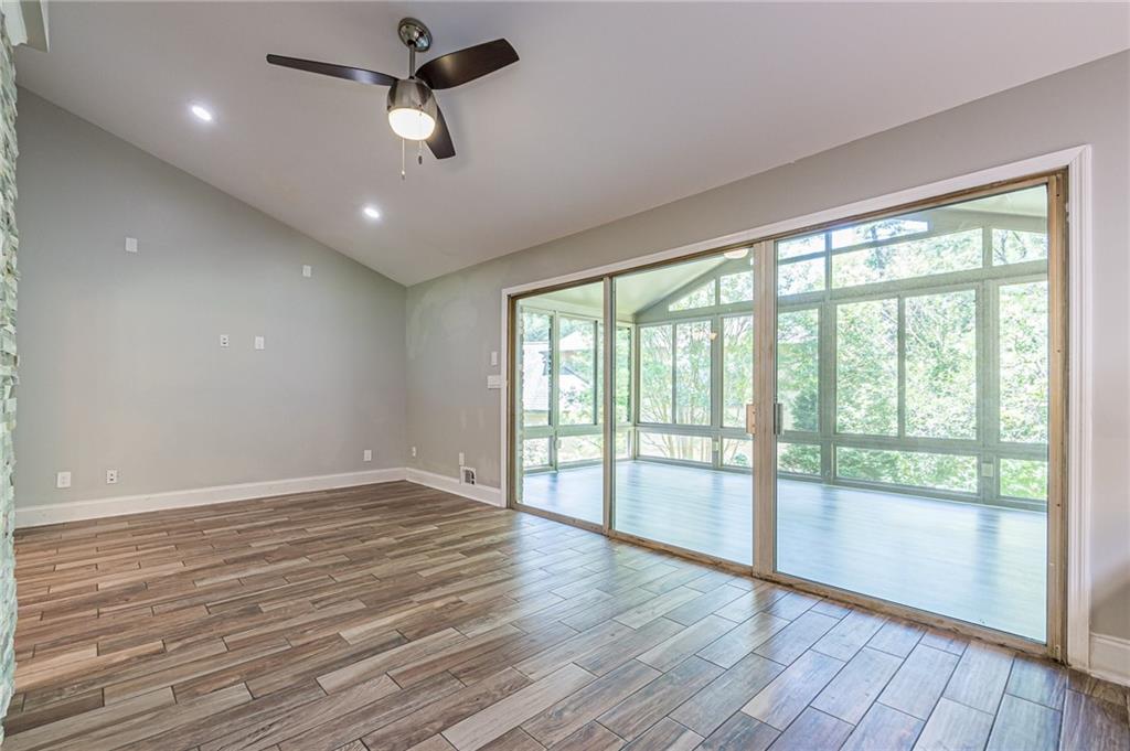 1574 Old Spring House Lane Atlanta, GA 30338 - Photo 24 of 55 a view of an empty room with wooden floor and a window