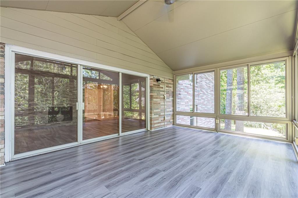 1574 Old Spring House Lane Atlanta, GA 30338 - Photo 25 of 55 a view of an empty room with wooden floor and a window