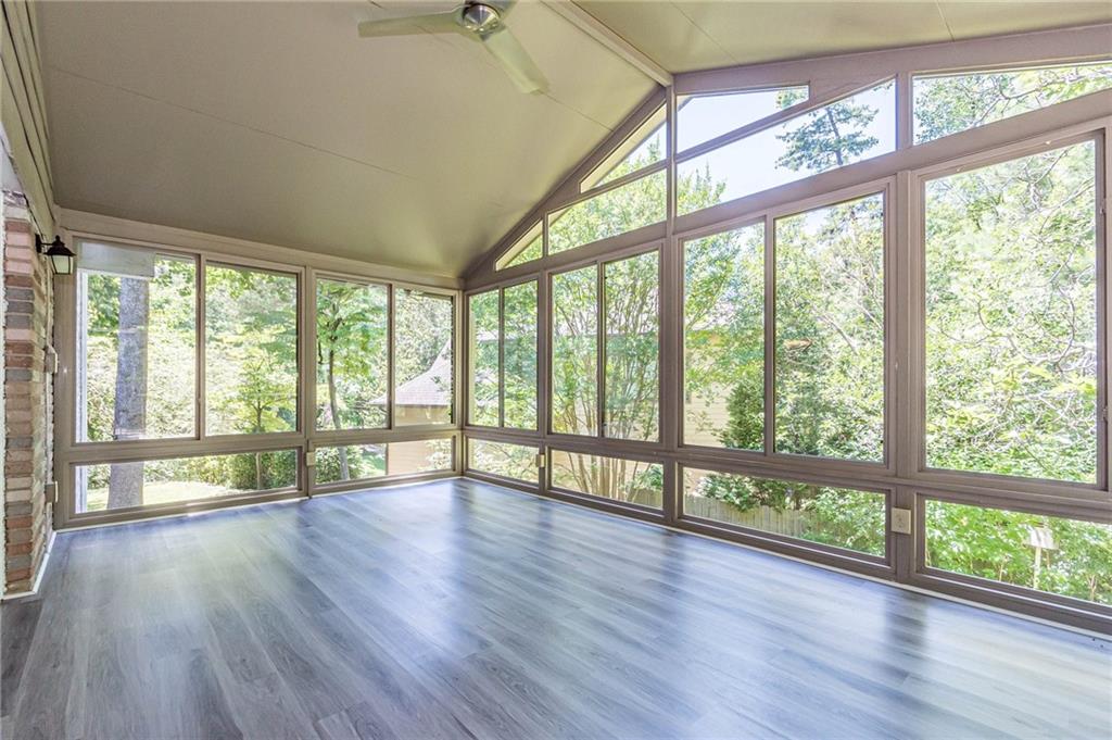 1574 Old Spring House Lane Atlanta, GA 30338 - Photo 28 of 55 a view of empty room with wooden floor and large window