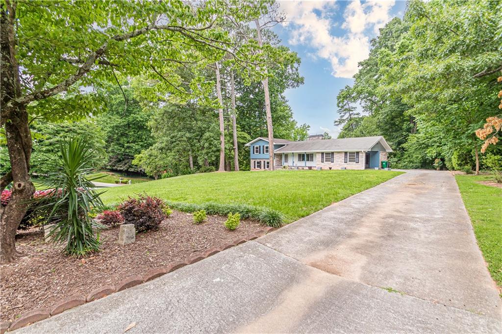 1574 Old Spring House Lane Atlanta, GA 30338 - Photo 3 of 55 a view of house with a yard