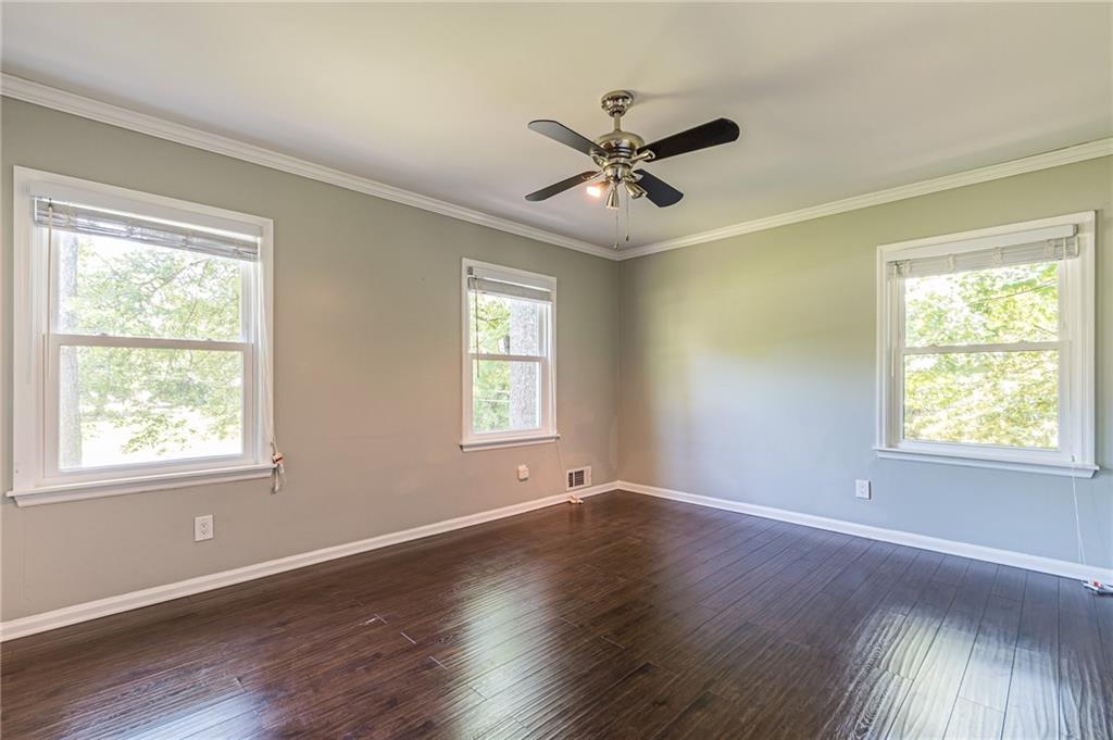 1574 Old Spring House Lane Atlanta, GA 30338 - Photo 34 of 55 a view of an empty room with wooden floor and a window