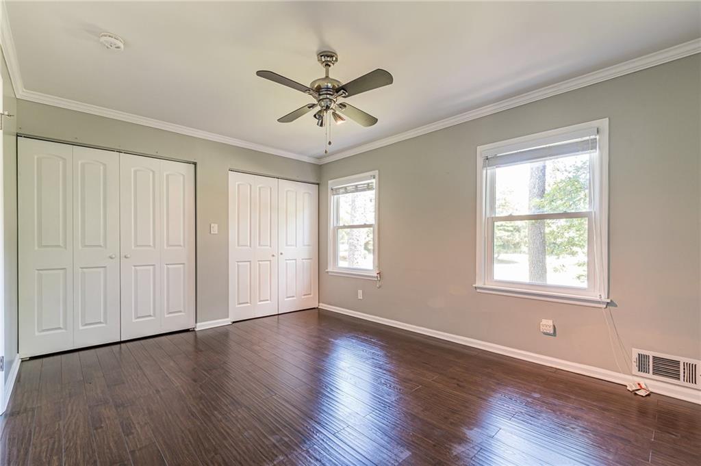 1574 Old Spring House Lane Atlanta, GA 30338 - Photo 35 of 55 a view of an empty room with wooden floor and a window
