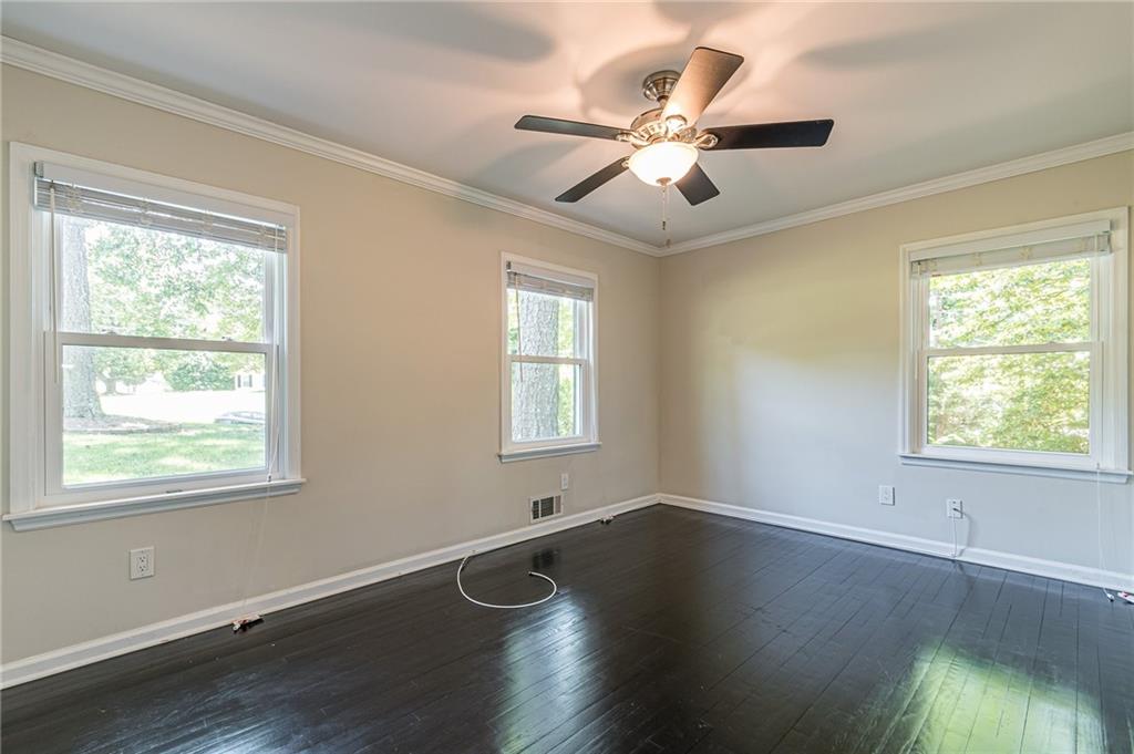 1574 Old Spring House Lane Atlanta, GA 30338 - Photo 37 of 55 a view of an empty room with wooden floor and a window