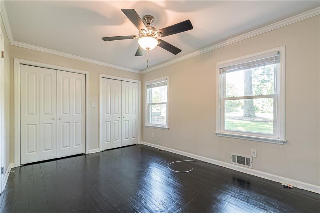 1574 Old Spring House Lane Atlanta, GA 30338 - Photo 38 of 55 a view of an empty room with wooden floor and a window