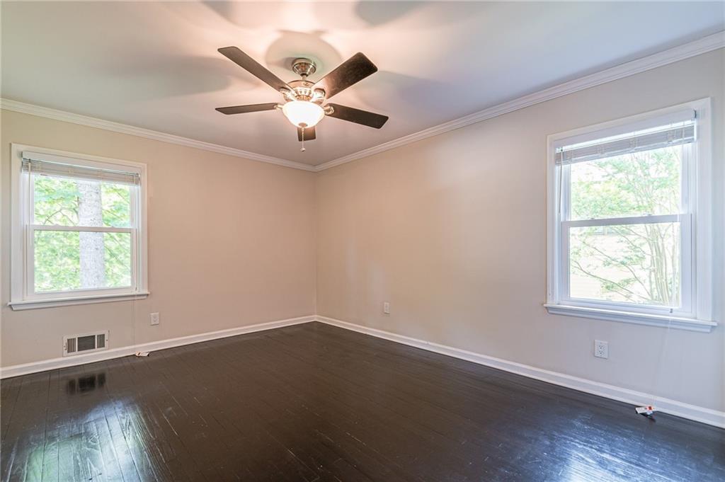 1574 Old Spring House Lane Atlanta, GA 30338 - Photo 41 of 55 an empty room with wooden floor fan and windows