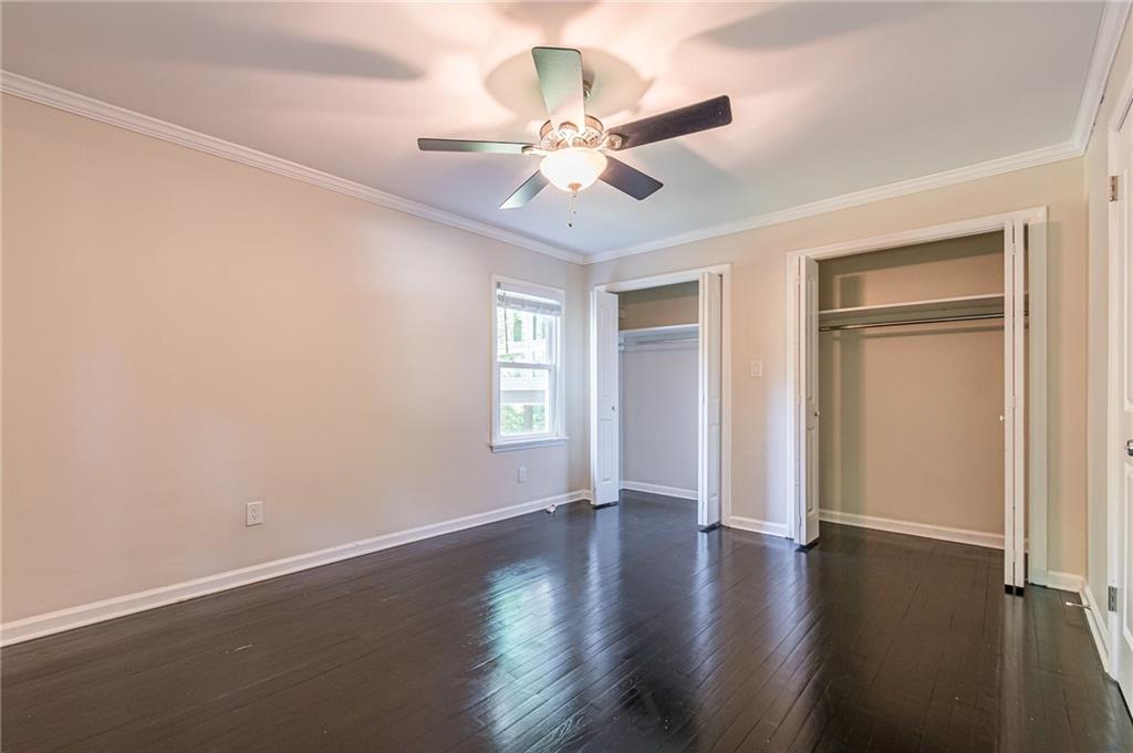 1574 Old Spring House Lane Atlanta, GA 30338 - Photo 42 of 55 an empty room with wooden floor fan and windows