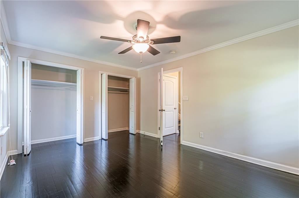 1574 Old Spring House Lane Atlanta, GA 30338 - Photo 43 of 55 an empty room with wooden floor fan and windows