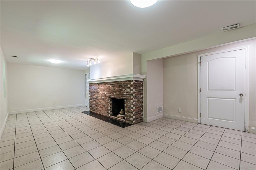1574 Old Spring House Lane Atlanta, GA 30338 - Photo 45 of 55 a view of an empty room and fire place