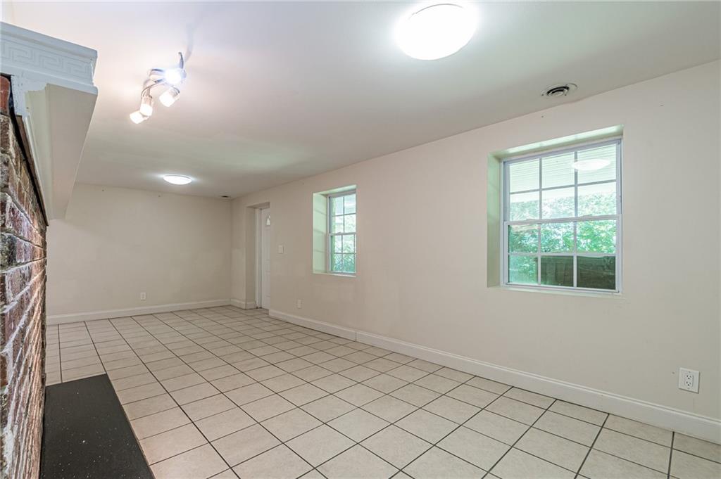 1574 Old Spring House Lane Atlanta, GA 30338 - Photo 48 of 55 an empty room with windows and fan