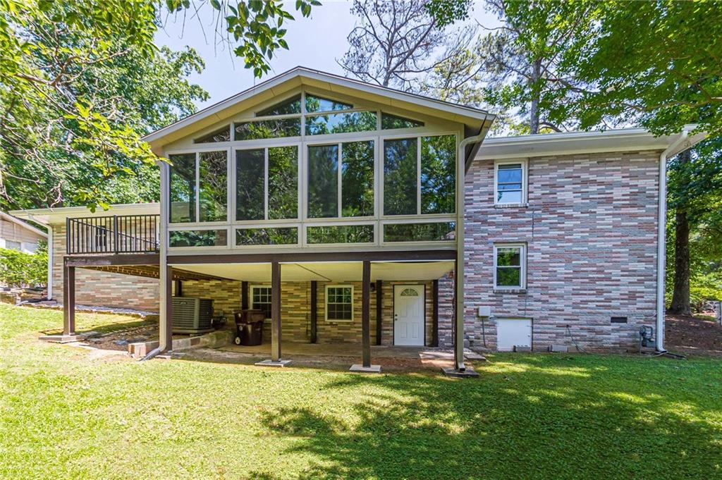 1574 Old Spring House Lane Atlanta, GA 30338 - Photo 49 of 55 a view of a house with a yard and sitting area