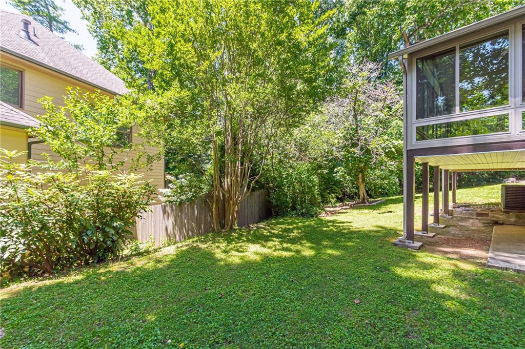 1574 Old Spring House Lane Atlanta, GA 30338 - Photo 51 of 55 a view of a house with a backyard and a tree