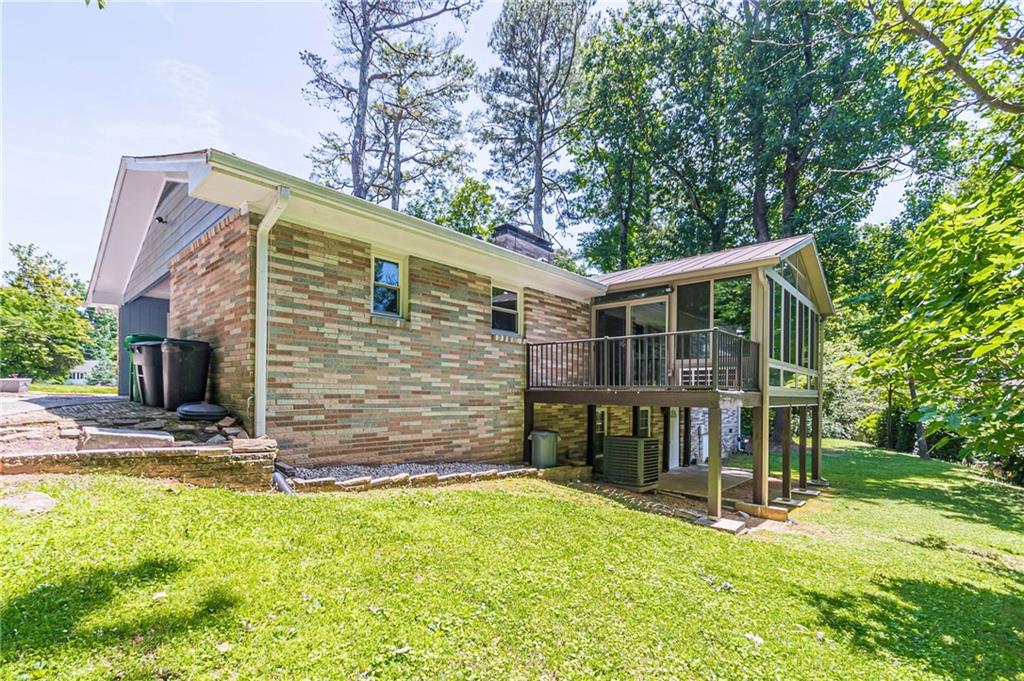 1574 Old Spring House Lane Atlanta, GA 30338 - Photo 52 of 55 a view of a house with backyard and a tree
