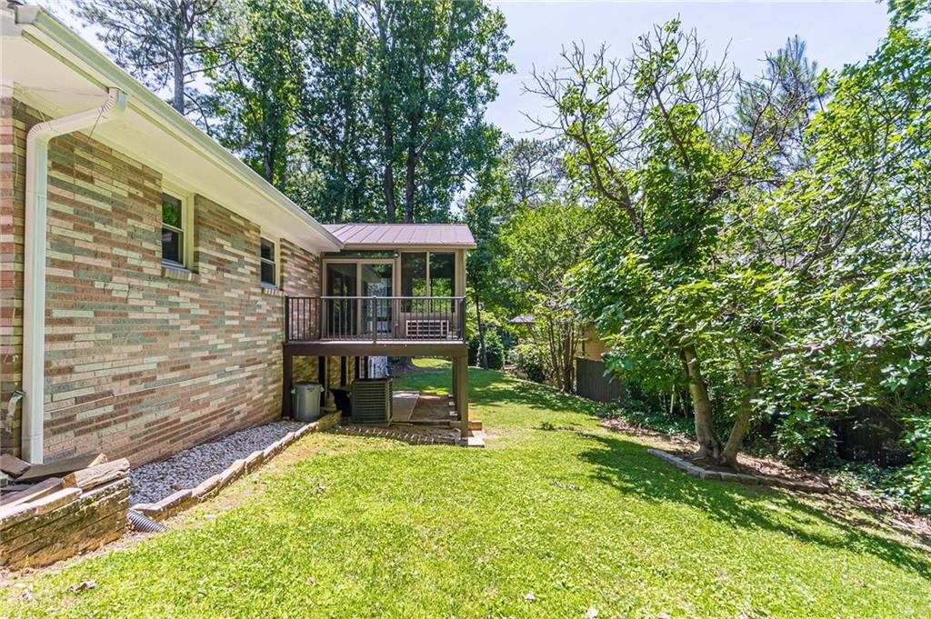 1574 Old Spring House Lane Atlanta, GA 30338 - Photo 53 of 55 a view of house with backyard and sitting area