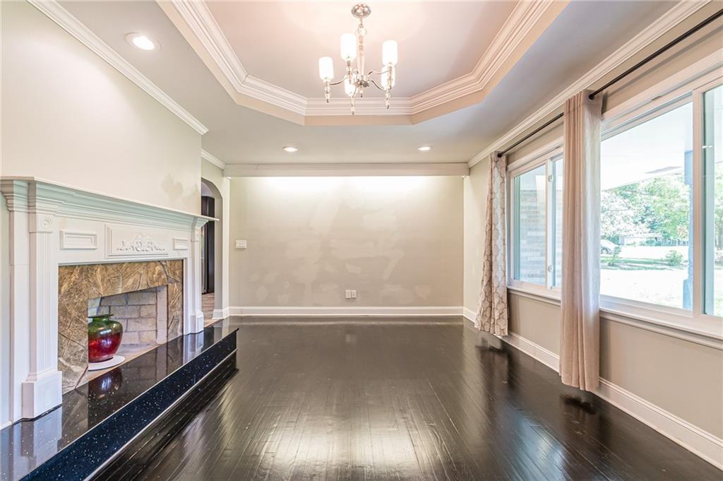 1574 Old Spring House Lane Atlanta, GA 30338 - Photo 8 of 55 a view of an empty room with wooden floor and a window
