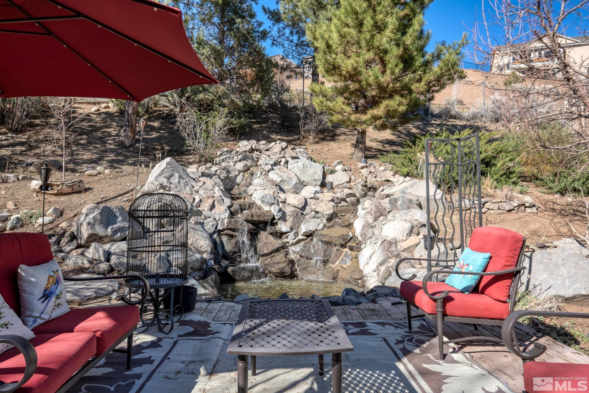 595 Cliff View Drive Reno, NV 89523 - Photo 34 of 40 an outdoor sitting area with furniture and wooden fence