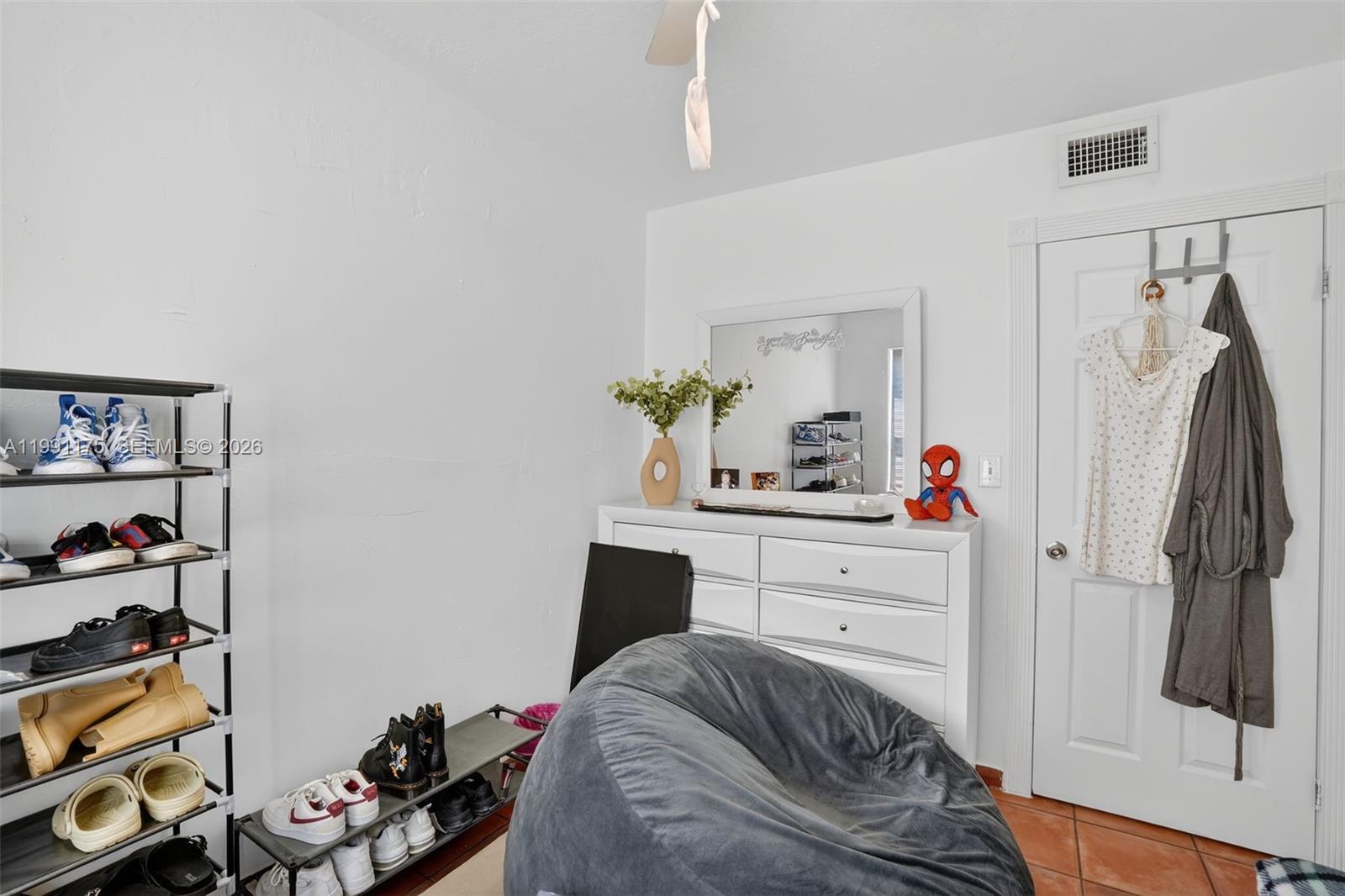 10055 Southwest 52nd Terrace Miami, FL 33165 - Photo 21 of 36 a bedroom with a bed and a window