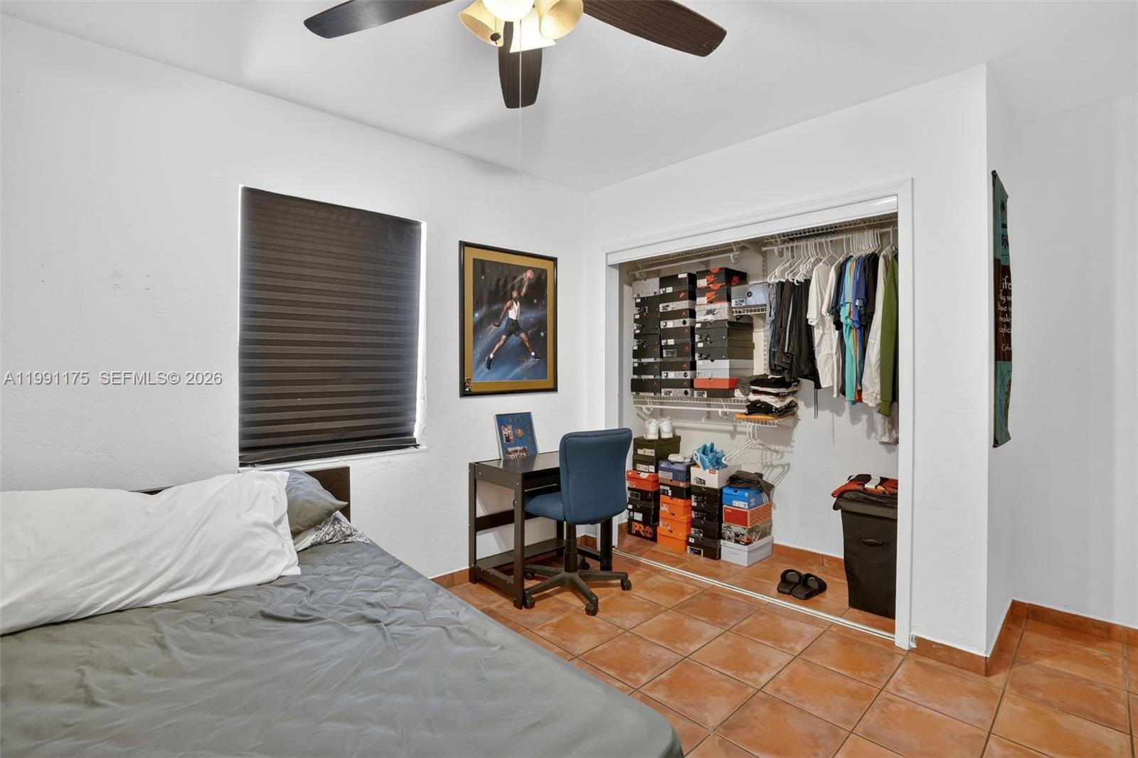 10055 Southwest 52nd Terrace Miami, FL 33165 - Photo 23 of 36 a bedroom with furniture and a flat screen tv