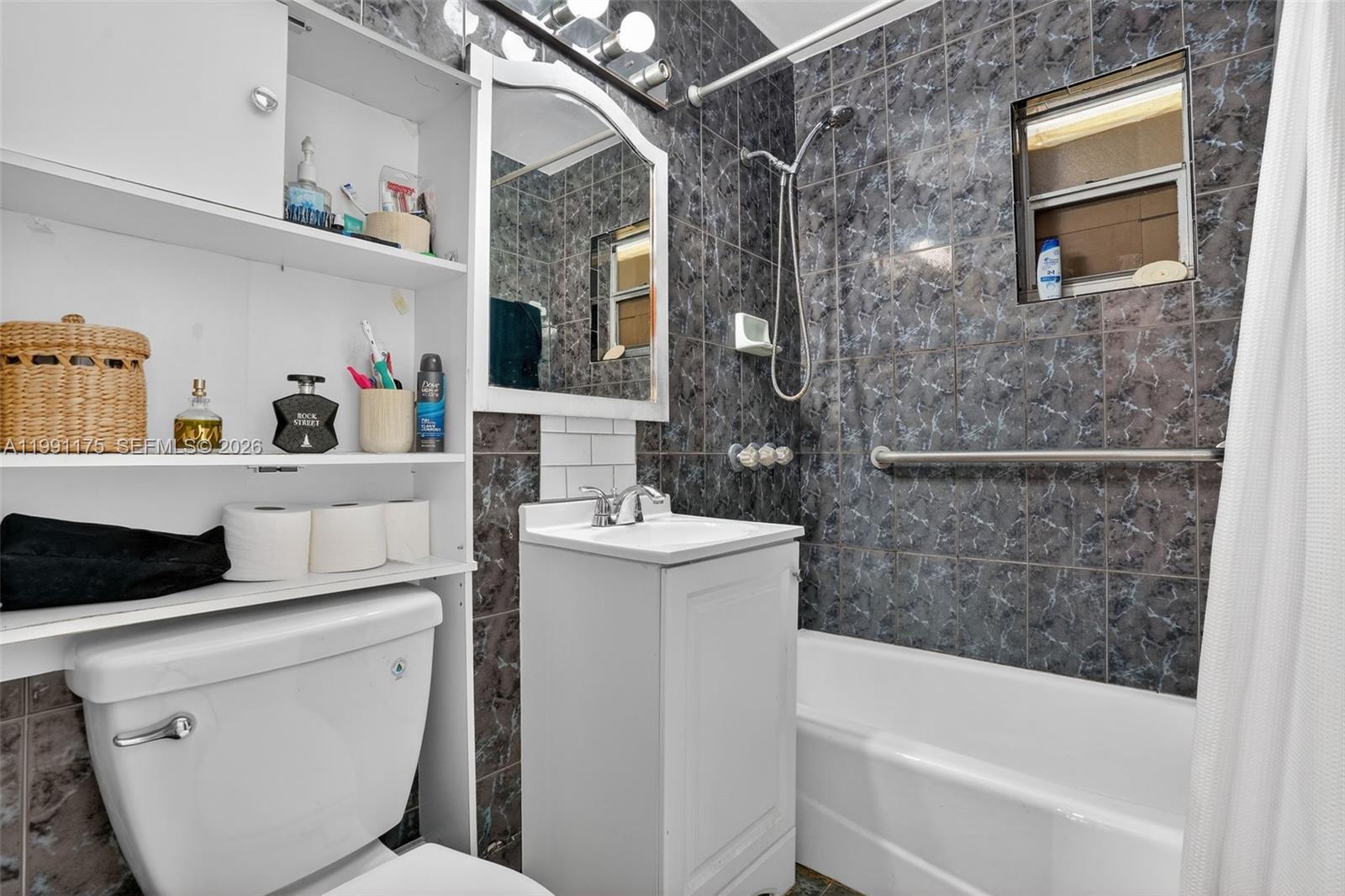 10055 Southwest 52nd Terrace Miami, FL 33165 - Photo 24 of 36 a bathroom with a bathtub sink and toilet