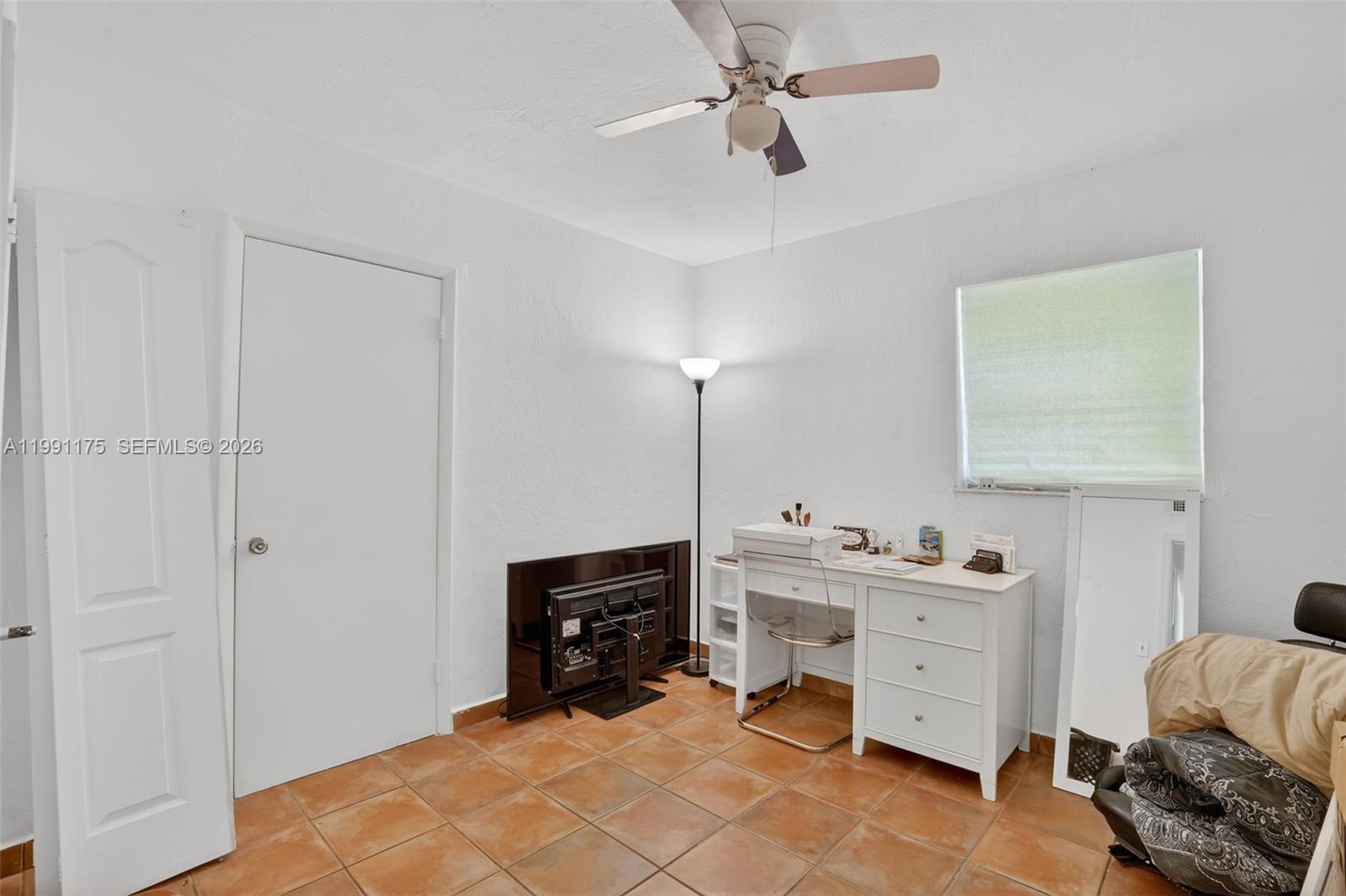 10055 Southwest 52nd Terrace Miami, FL 33165 - Photo 25 of 36 a bedroom with a bed and a closet