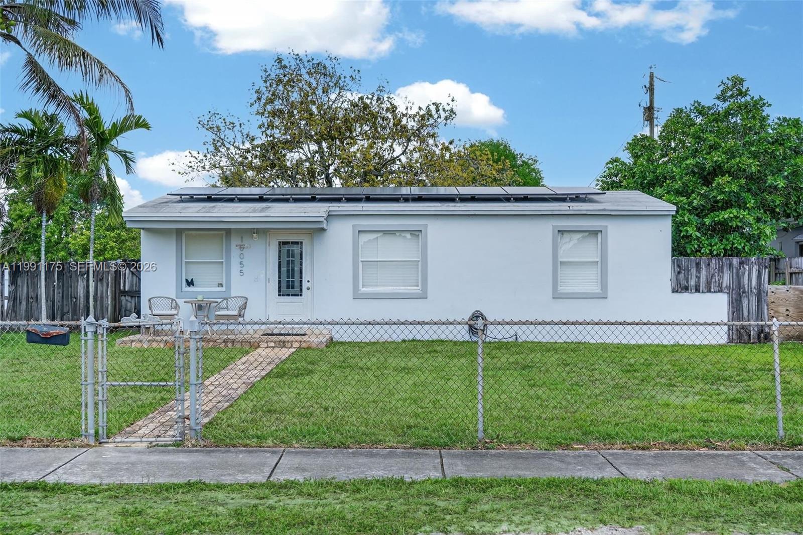 10055 Southwest 52nd Terrace Miami, FL 33165 - Photo 3 of 36 a house view with a garden space