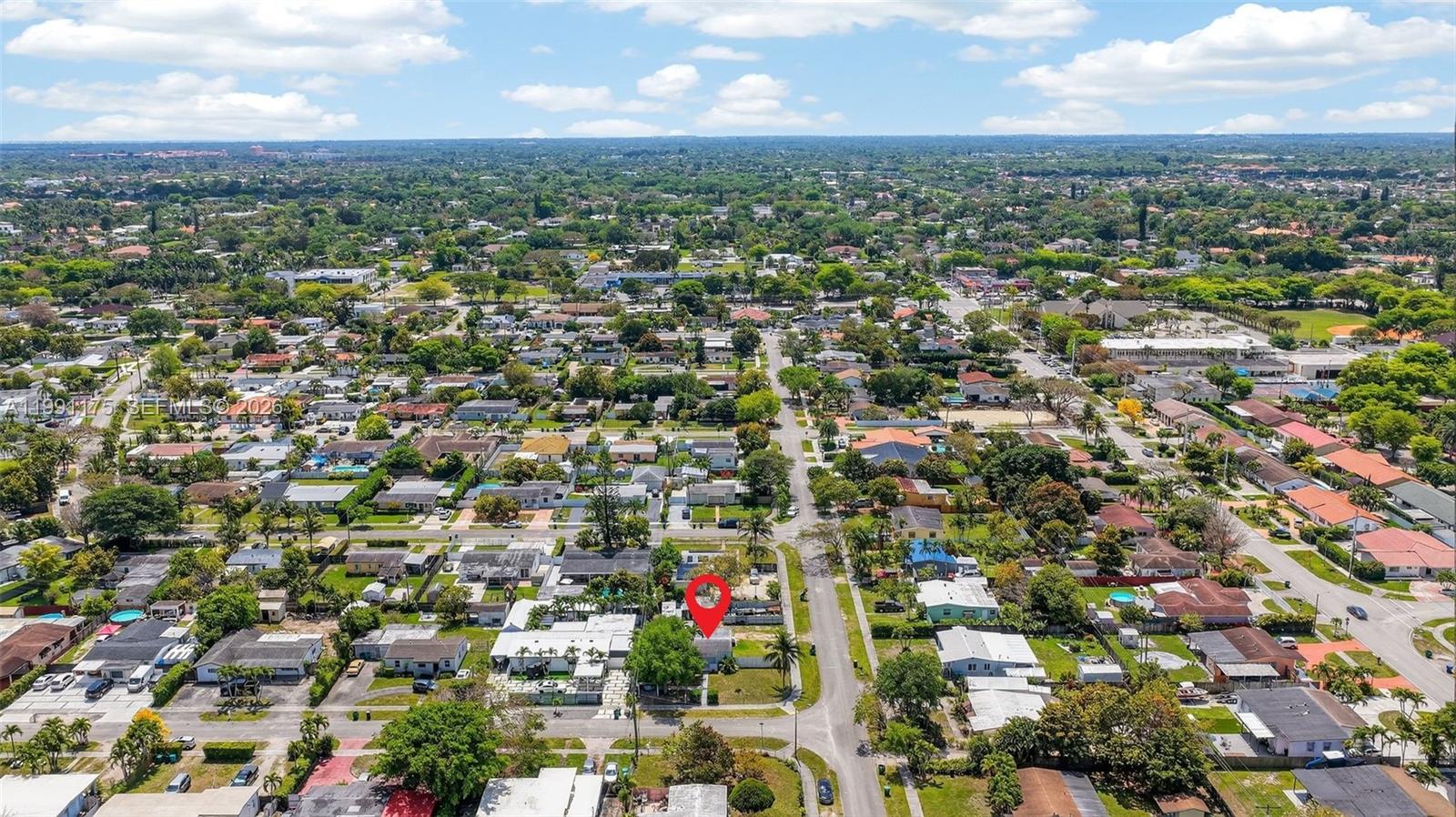 10055 Southwest 52nd Terrace Miami, FL 33165 - Photo 34 of 36 an aerial view of residential houses with city view