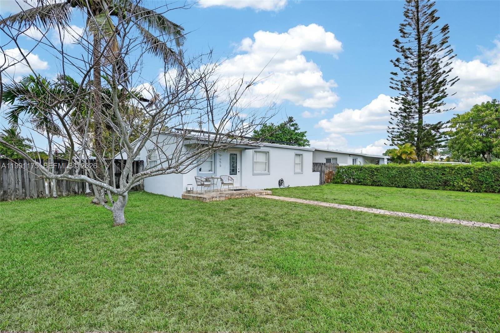 10055 Southwest 52nd Terrace Miami, FL 33165 - Photo 5 of 36 a view of a house with backyard