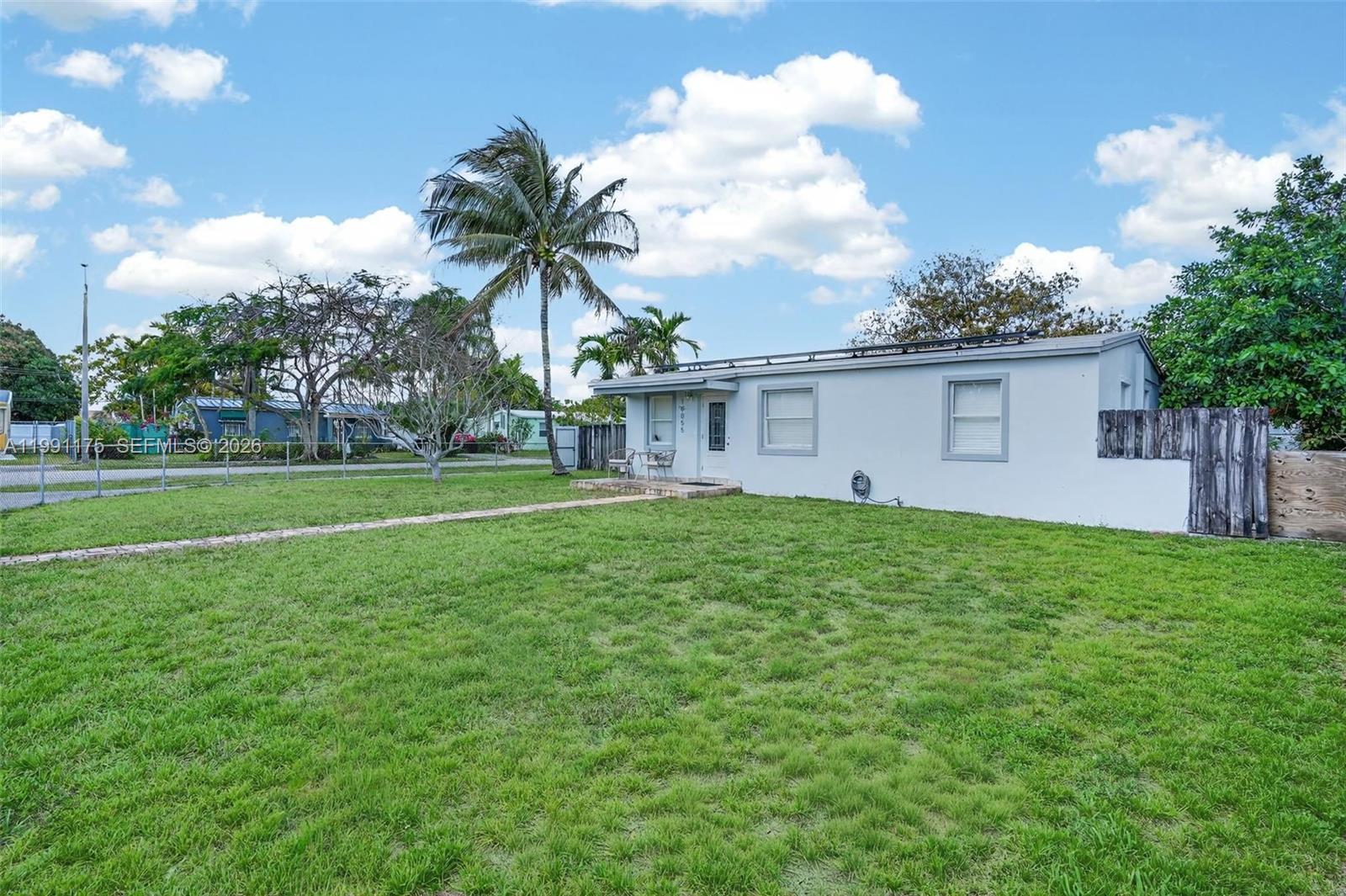 10055 Southwest 52nd Terrace Miami, FL 33165 - Photo 6 of 36 a view of a backyard with a garden