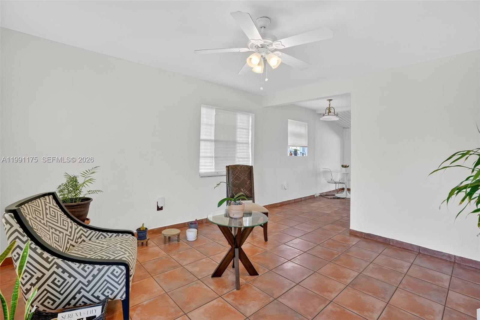 10055 Southwest 52nd Terrace Miami, FL 33165 - Photo 8 of 36 a workspace with furniture and a potted plant