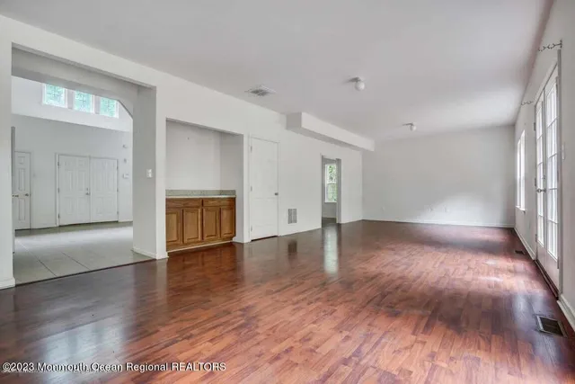 a view of staircase with wooden floor