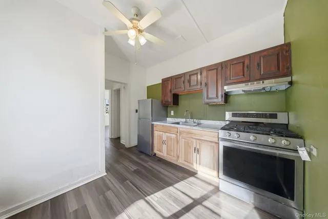 a kitchen with a stove oven and sink