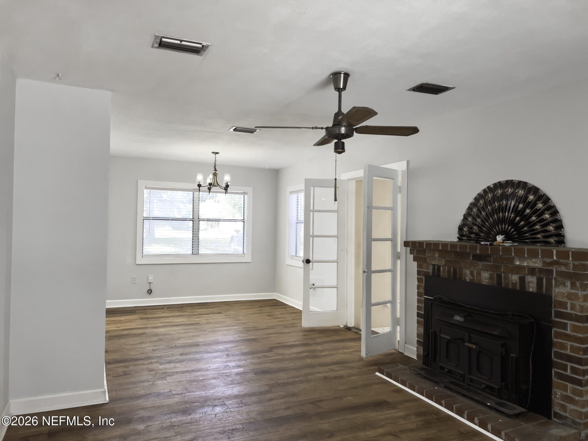 2085 Mills Road Jacksonville, FL 32216 - Photo 11 of 13 a living room with furniture and a fireplace