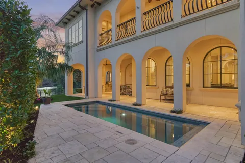 a view of a swimming pool with a yard