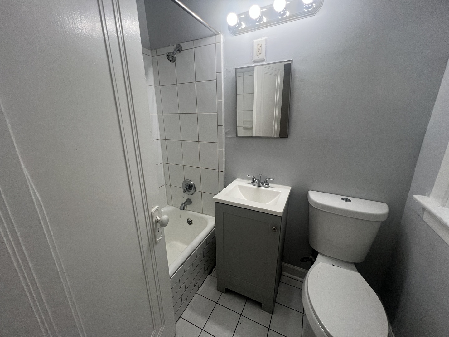 243 East 108th Street, Unit 2 Chicago, IL 60628 - Photo 8 of 8 a bathroom with a sink and toilet