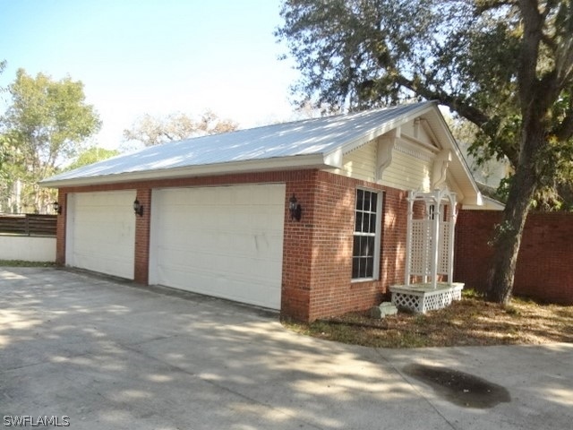 14071 Cemetery Road Fort Myers, FL 33905 - Photo 17 of 18 a view of a house with a snow in the yard