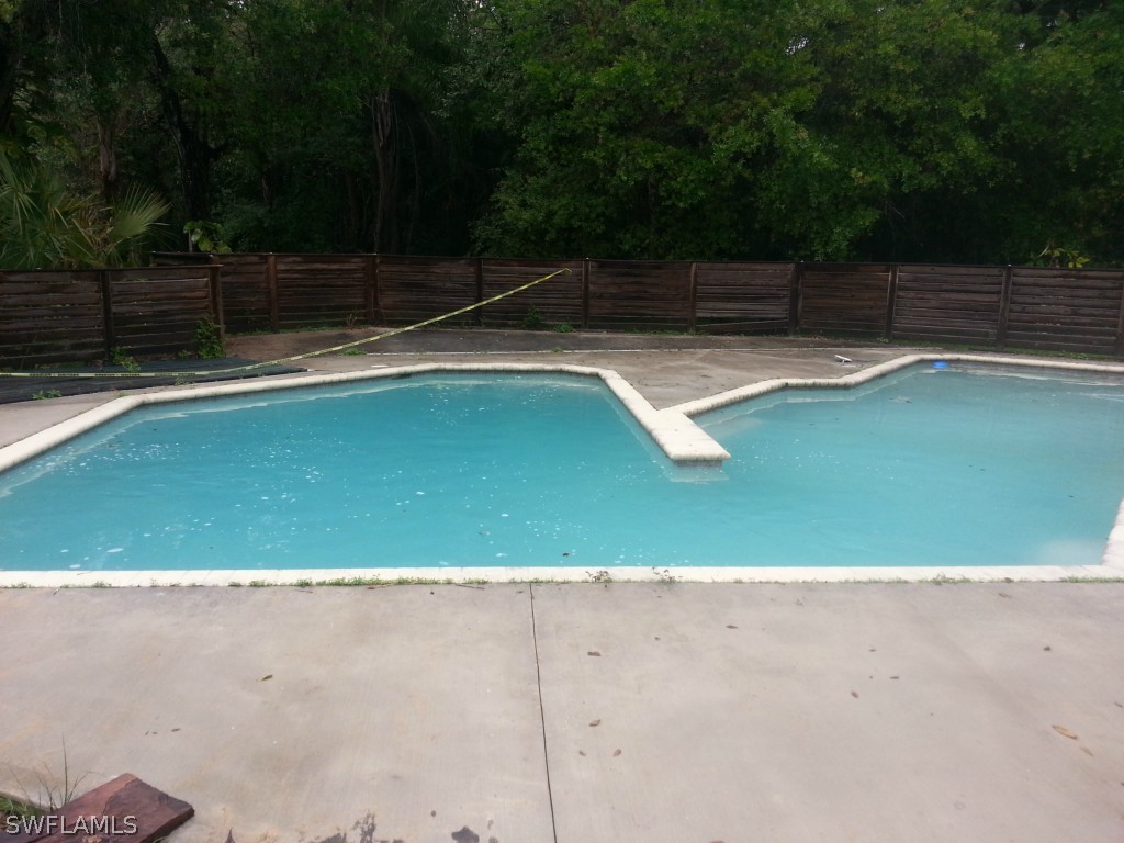 14071 Cemetery Road Fort Myers, FL 33905 - Photo 18 of 18 a view of a swimming pool with a yard