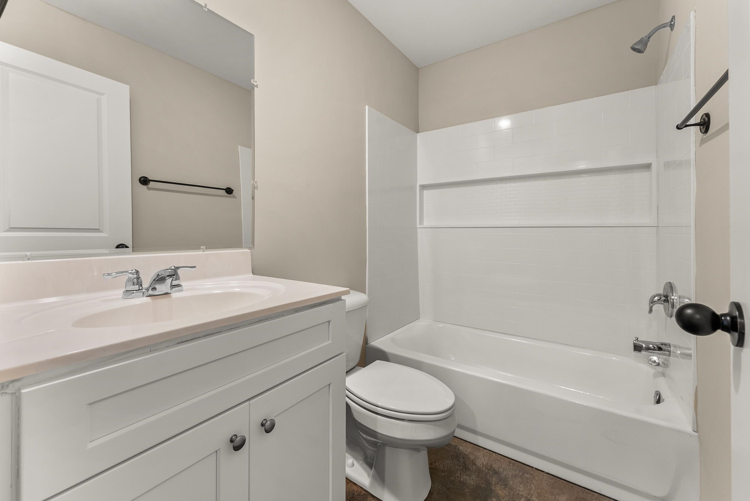 370 Watson Dr Extension Gallaway, TN 38002 - Photo 22 of 27 a bathroom with a sink a toilet and a bathtub