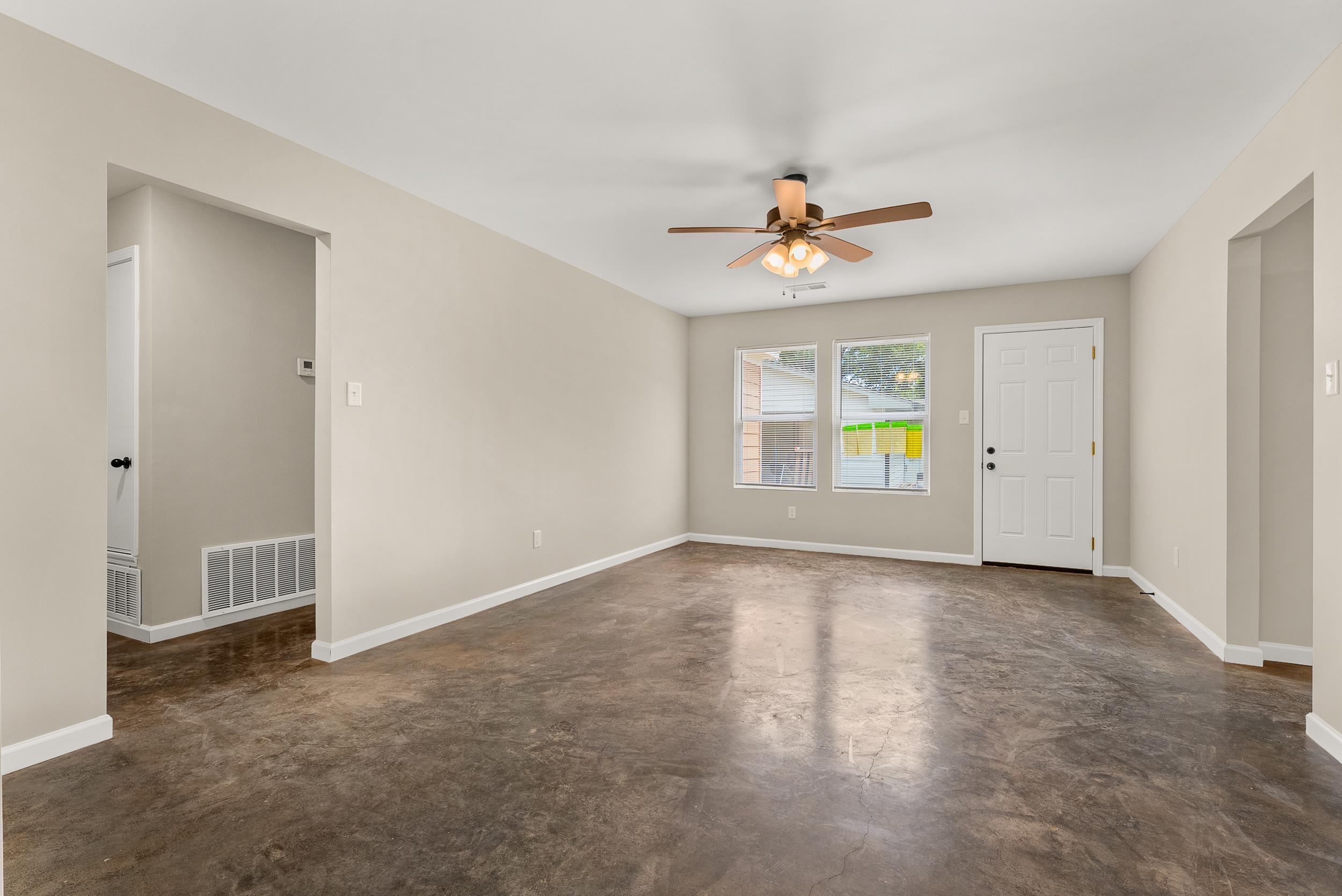 370 Watson Dr Extension Gallaway, TN 38002 - Photo 5 of 27 an empty room with windows and chandelier fan