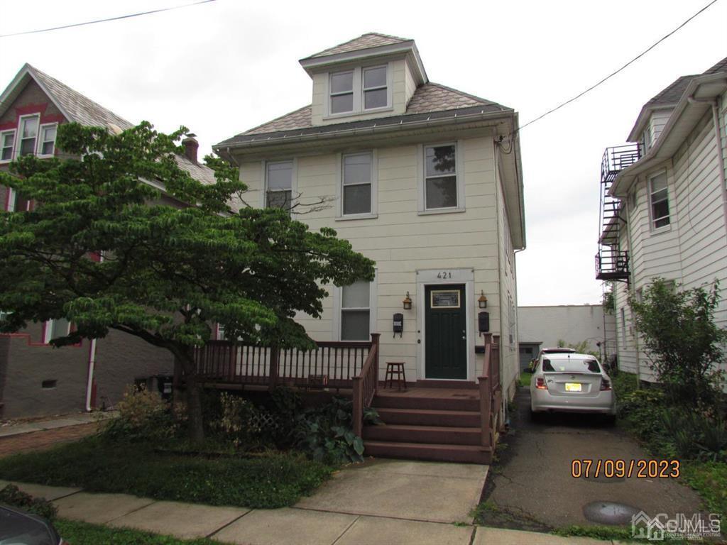 421 Magnolia Street, Unit 2 Highland Park, NJ 08904 - Photo 1 of 14 a view of a house with a yard