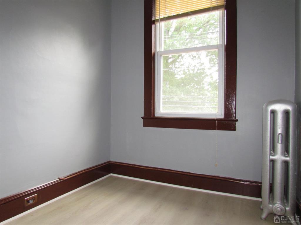 421 Magnolia Street, Unit 2 Highland Park, NJ 08904 - Photo 12 of 14 a view of empty room with window