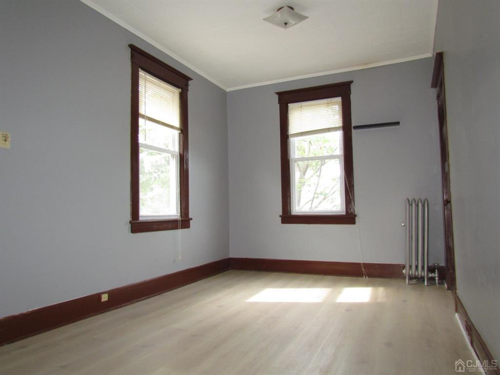 421 Magnolia Street, Unit 2 Highland Park, NJ 08904 - Photo 10 of 14 an empty room with a window