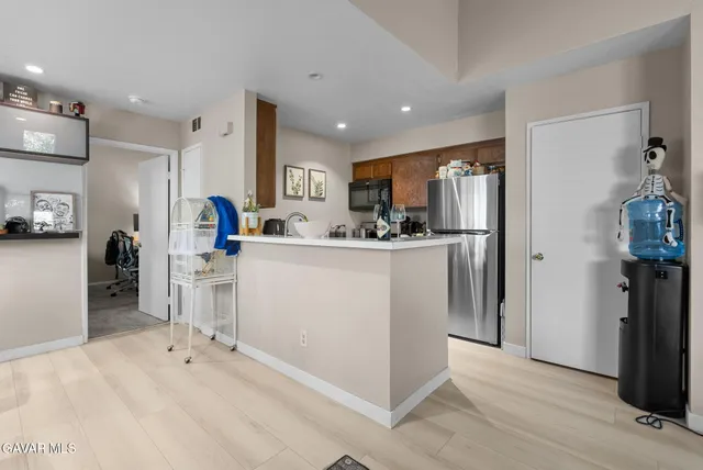 a room with a sink a washer and dryer