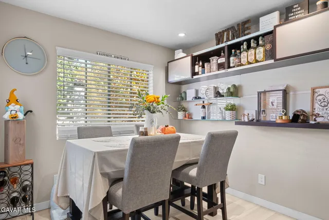 a dining room with furniture and window