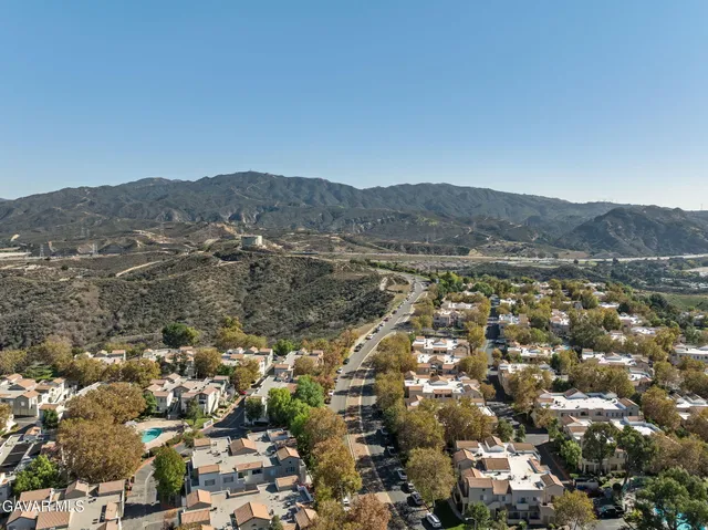 an aerial view of residential house and green space