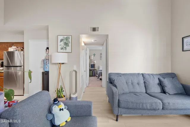 a living room with furniture and a couch