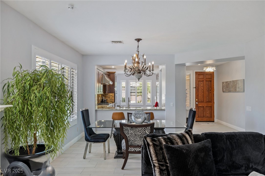 3 Chatmoss Road Henderson, NV 89052 - Photo 14 of 41 Dining room with a chandelier and baseboards