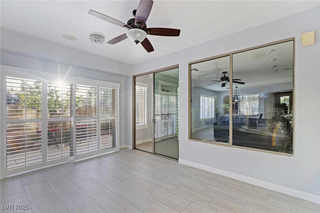 3 Chatmoss Road Henderson, NV 89052 - Photo 15 of 41 Unfurnished room featuring ceiling fan, plenty of natural light, and baseboards