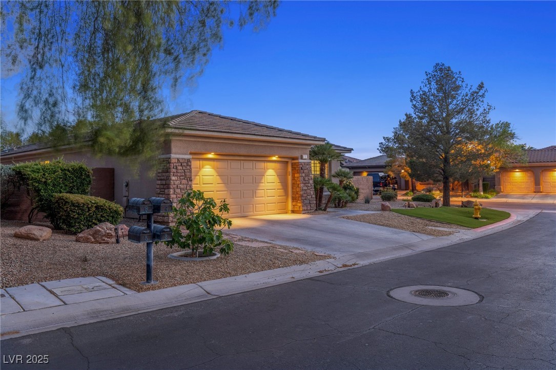 3 Chatmoss Road Henderson, NV 89052 - Photo 4 of 41 Ranch-style house featuring a tiled roof, an attached garage, driveway, and stucco siding