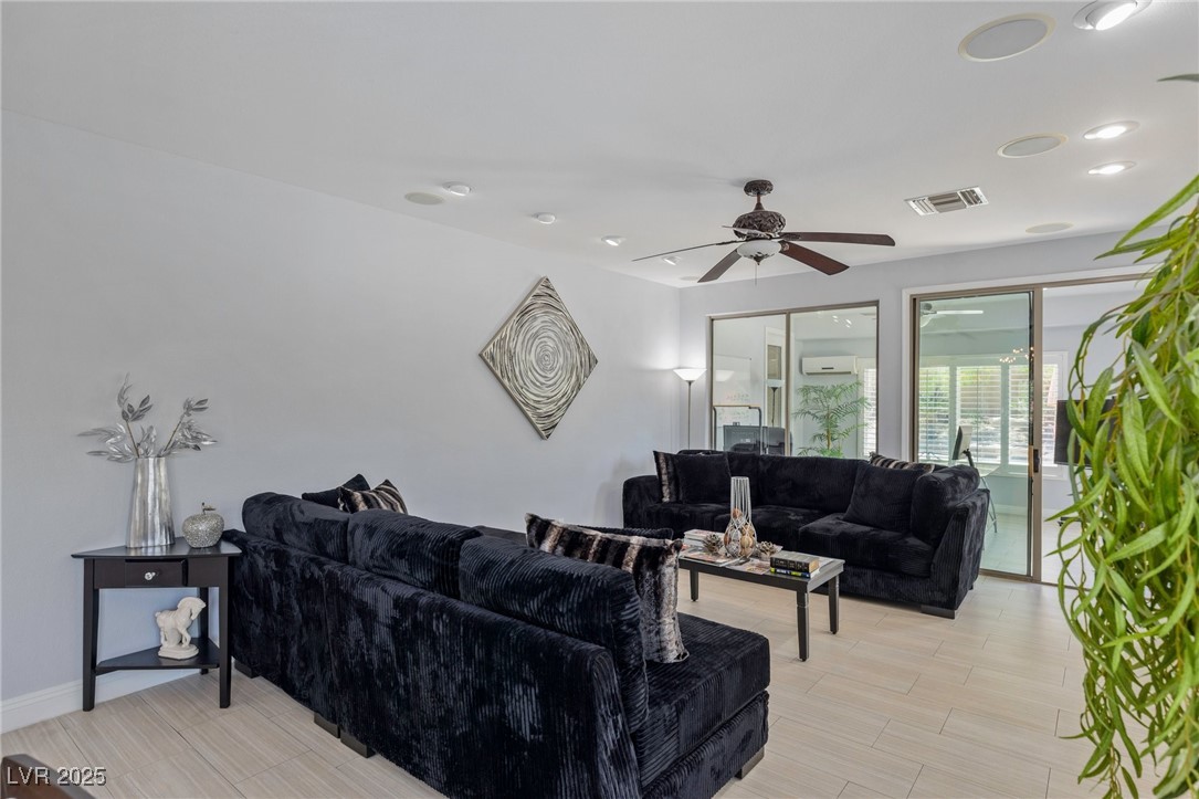 3 Chatmoss Road Henderson, NV 89052 - Photo 7 of 41 Living room featuring a wall mounted AC and a ceiling fan