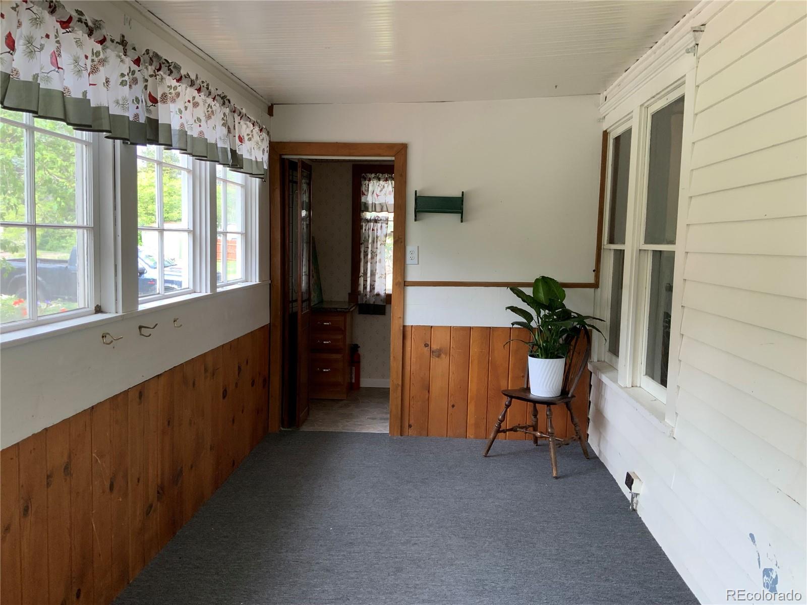 1011 Main Street Meeker, CO 81641 - Photo 9 of 28 a view of hallway with furniture and a window
